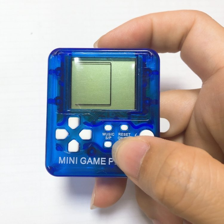4 PCS Handheld Mini Game Console Toy Classic Brick Game Console with Keychain… 4 PCS Handheld Mini Game Console Toy Classic Brick Game Console with Keychain…